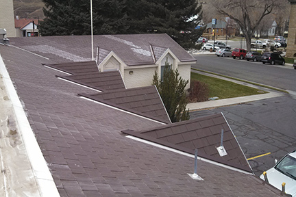 An example of the SnoFree™ 4” or 6” Existing Valley Panel installed on a shingle roof.
