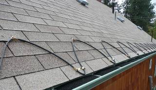An example of zig zag roof heat cables installed on a shingle roof.
